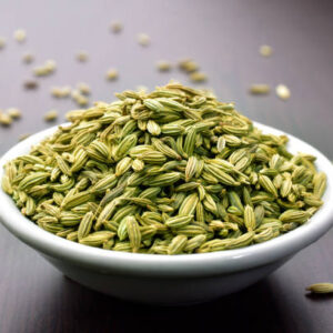 Fennel seeds in a bowl on a wooden table Fennel Seed