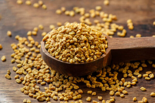 Fenugreek seeds in wooden spoon Fenugreek